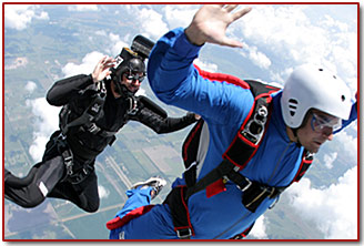 Skydiving coach and student over Skydive Spaceland